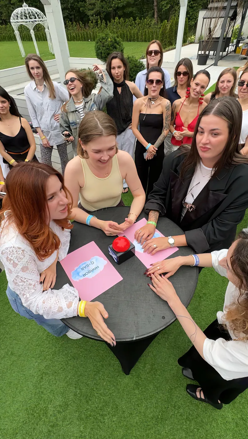 A team contest with a buzzer at a table in the villa