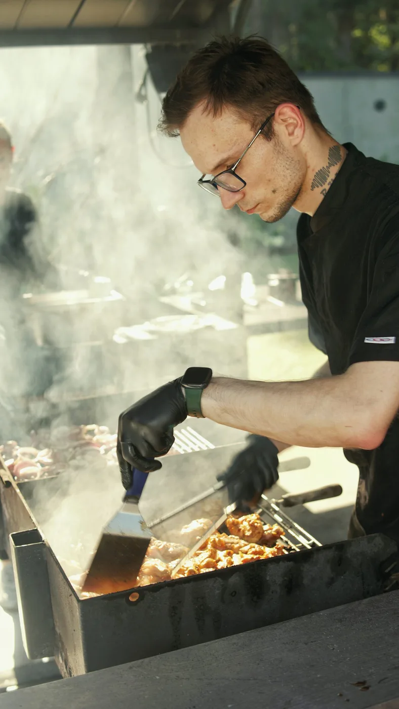 Catering: preparing dishes on an outdoor grill