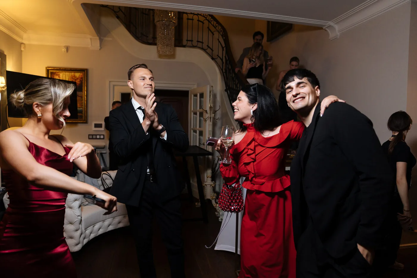 Guests celebrating inside the house, where the party was moved