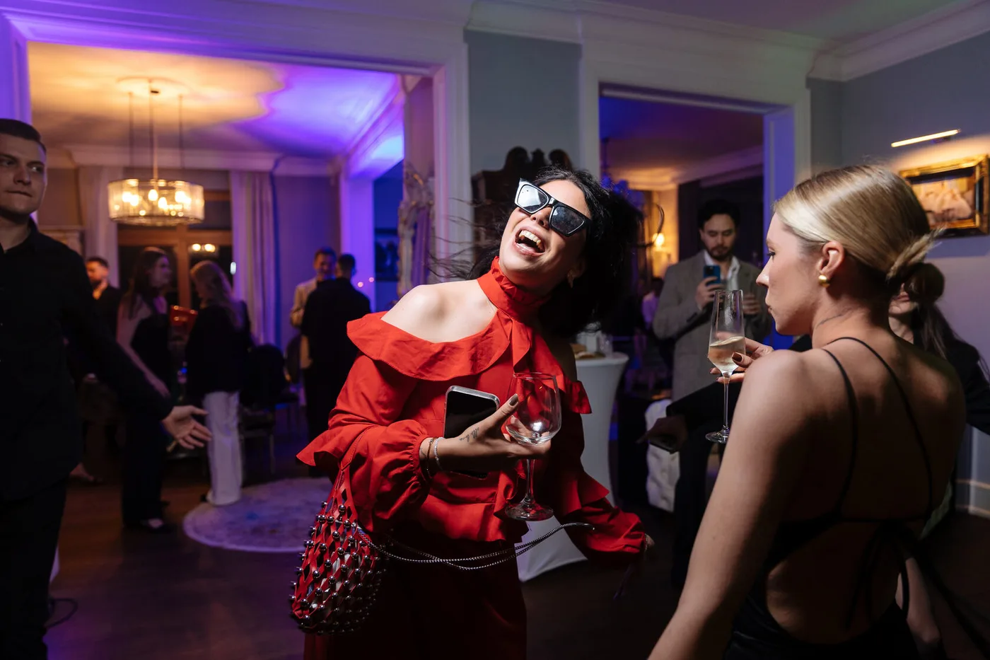Guests dancing indoors during the evening programme