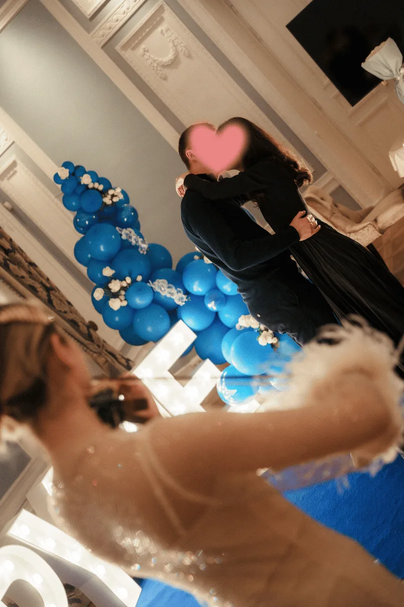 A couple embracing after a marriage proposal in the Hotel Bellotto hall — a Harbor of Events case study