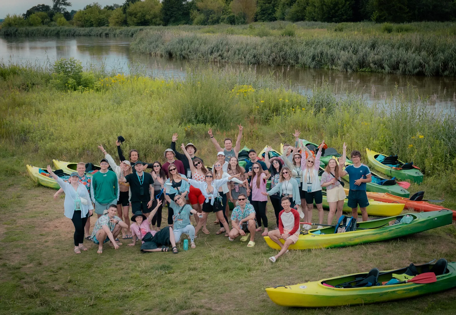 The OBRIO team on the riverbank among the kayaks during the two-day camp