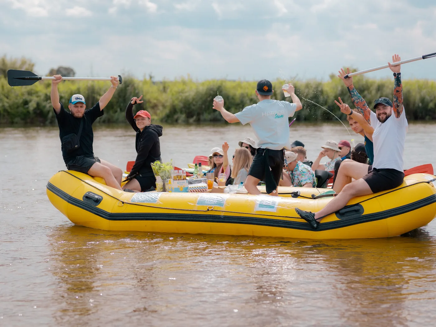 A floating bar on the water — a yellow raft with drinks during the trip