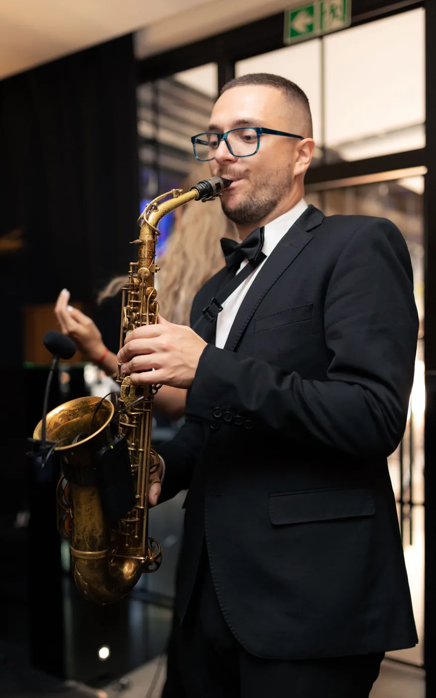 The saxophonist in a dinner jacket during a live performance at STIXX restaurant