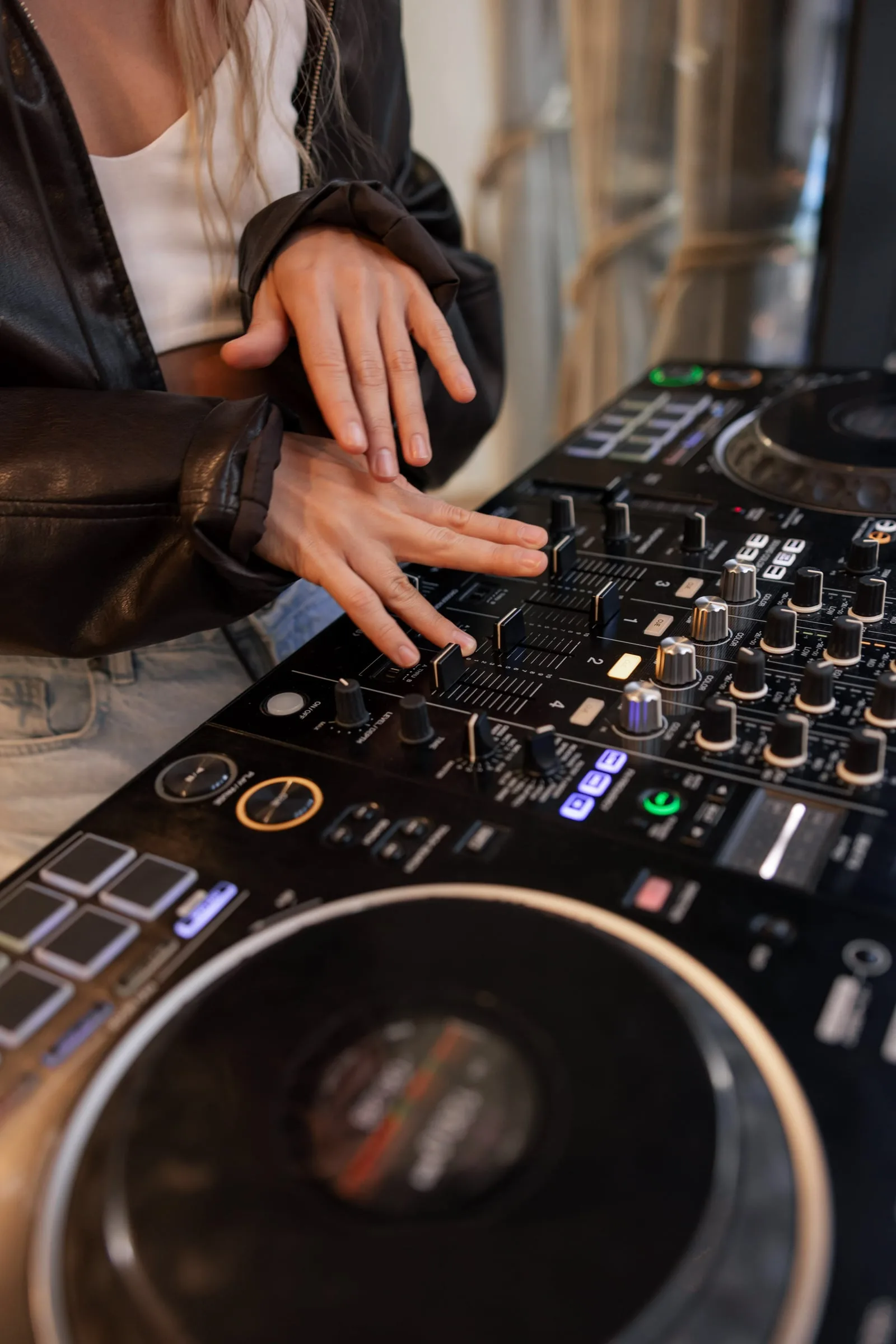 Hands on a DJ controller during the music part of Katia’s birthday